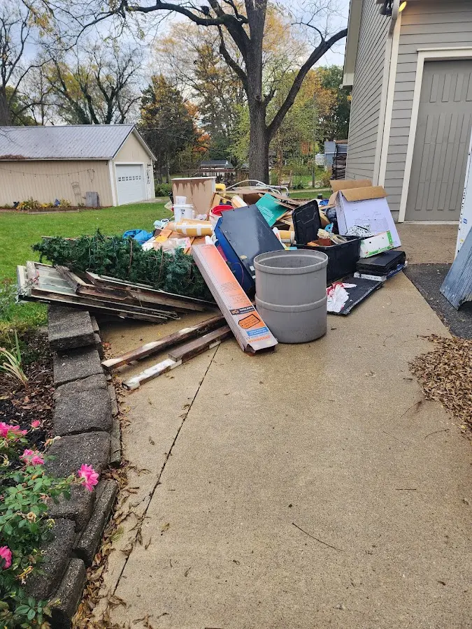Dumpster being loaded with debris for Residential Dumpster Rental in Kearney